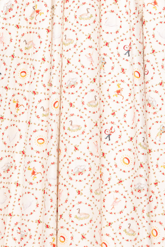 Textile with a pattern of small, colorful shapes on a white background