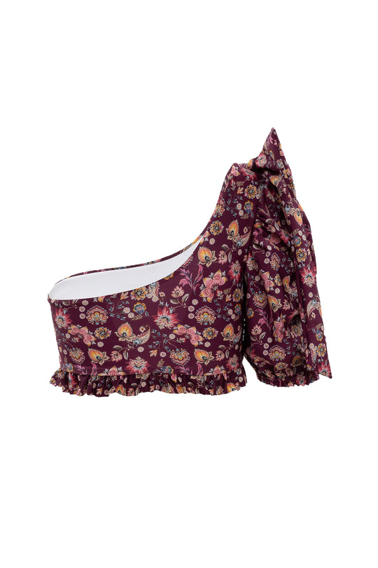 The Ivy City Co Sailor Top in Stephanie Floral is a maroon one-shoulder swim top with a ruffled hem and bold bow accent, blending playful charm and elegant style.