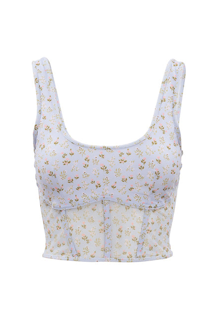The Serena Top in Blue Ditsy Floral by Ivy City Co is a sleeveless, light blue swim top with a scoop neck, ditsy floral print, and front seam details—ideal as a summer staple or chic swimwear.