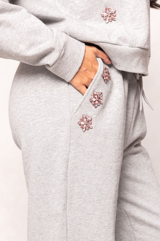 grey sweatsuit against a white background