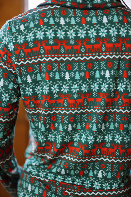 Person wearing a green and red holiday sweater with festive patterns, as cozy as the So Soft Pajama Set in Alpine Noel from Ivy City Co. The image highlights the back of the sweater.