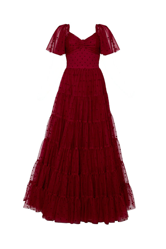 Red evening gown with a tiered skirt on a white background