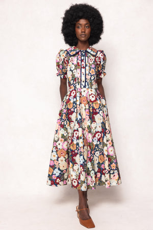 Woman wearing a floral dress on a white background