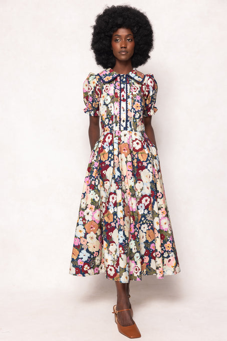 Woman wearing a floral dress on a white background