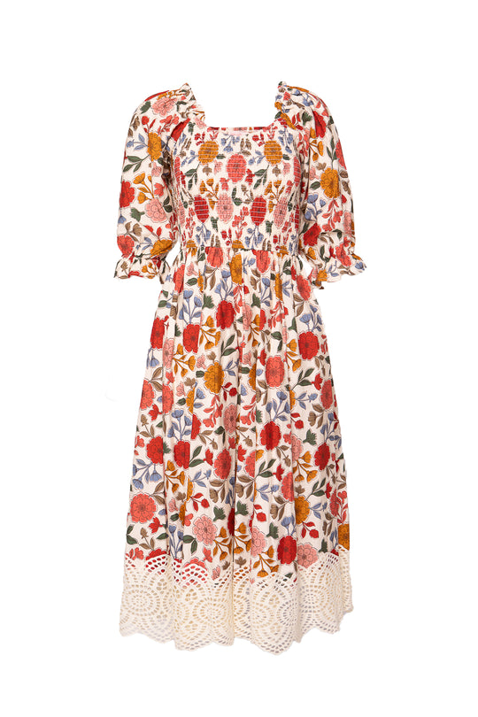 The Teagan Dress in Sepia Flower by Ivy City Co is a floral midi with puffed sleeves, a square neckline, and cream lace hem. Its relaxed fit ensures comfort and style, making it maternity friendly.