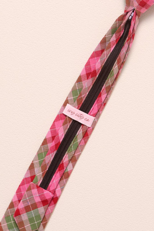 Pink plaid tie on a beige background