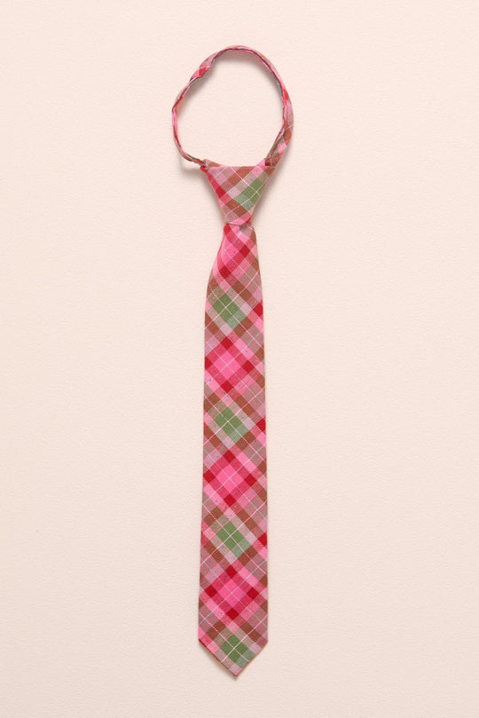 Plaid tie with pink, green, and red pattern on a beige background