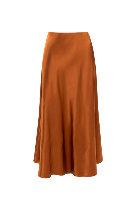 The Ivy City Co Tiff Maxi Skirt in Copper, made from luxurious satin, features a high-waisted fit, slight flare, and flowing hem, showcased elegantly against a plain white background.