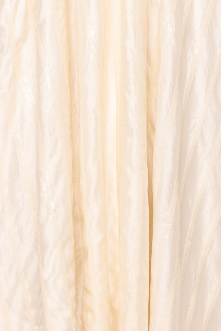 Close-up of beige and white yarn with a gradient effect