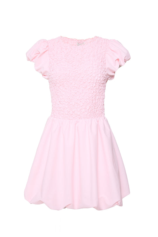 Pink dress against a white background