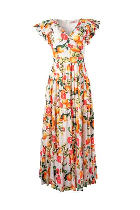 The Trixie Dress in Citrus by Ivy City Co is a sleeveless, maxi cotton dress with a v-neckline, ruffled shoulders, and a vibrant orange and green fruit print on white.