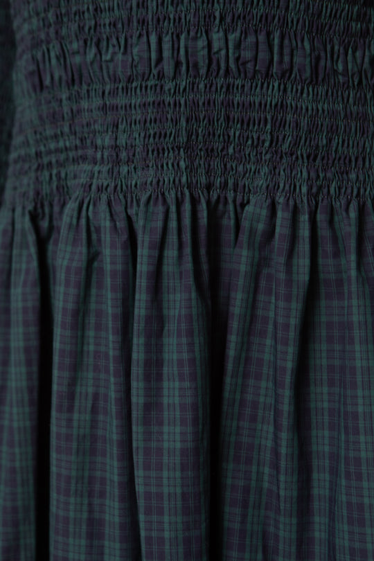 Plaid patterned fabric with a focus on texture and color.