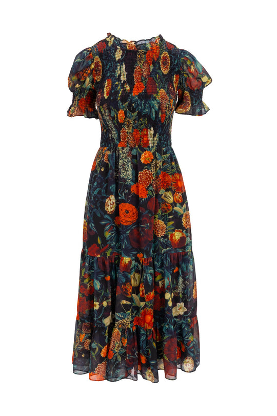 The Cordelia Dress in Moody Floral by Ivy City Co is a knee-length chiffon midi dress with short sleeves, a smocked bodice, and a ruffled hem. It features a vibrant floral print in shades of red, orange, yellow, and green on a dark background—making it the perfect fall dress that’s also maternity friendly for ultimate comfort.