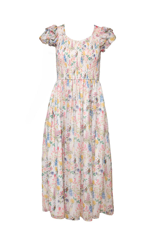 The Hattie Dress in Cordelia Floral by Ivy City Co is a maternity-friendly A-line midi dress featuring pastel floral print, short puffed sleeves, a smocked bodice, and a flowing skirt.