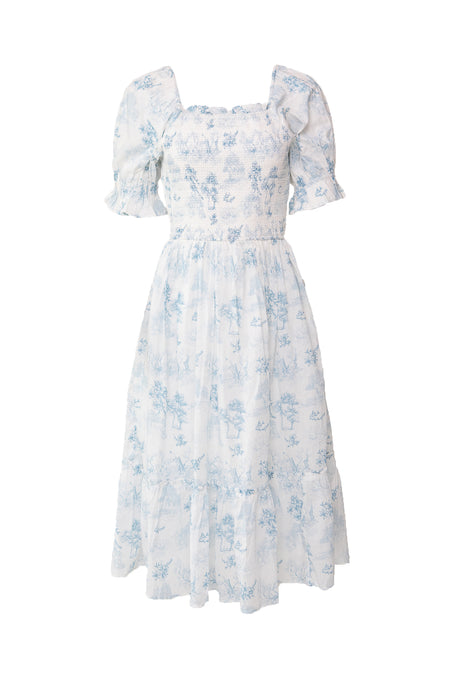 The Ivy City Co Valencia Dress is a light blue and white floral cotton dress with puffed short sleeves, smocked bodice, square neckline, and tiered skirt. Maternity friendly for comfortable, effortless style.