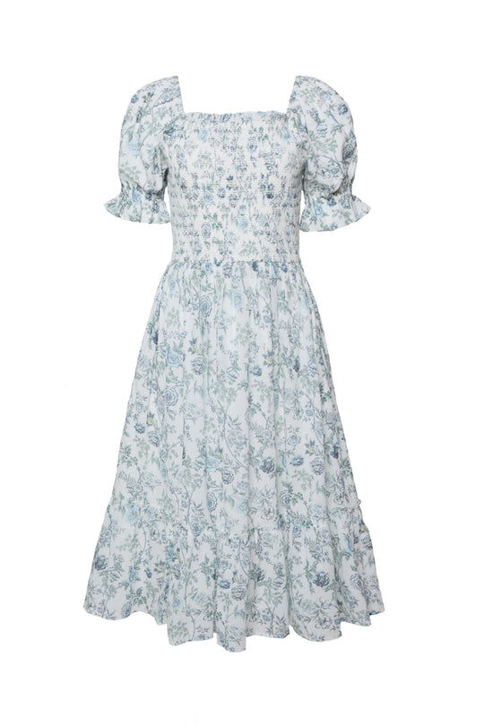 The Valencia Dress in Ivory Climbing Vine Bloom by Ivy City Co is a charming ivory maternity-friendly midi dress featuring light blue floral print, puffed short sleeves, a square neckline, a fitted bodice, and a gathered, flowing skirt.