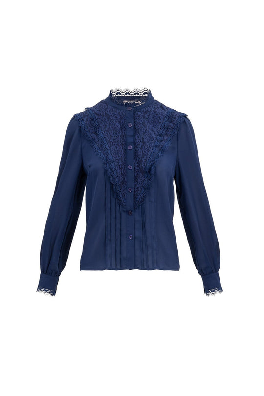 The Blythe Blouse in Navy by Ivy City Co is a long-sleeve blouse featuring a lace-trimmed neckline, nursing-friendly button-down front, pleated details, and lace accents on the collar and cuffs.