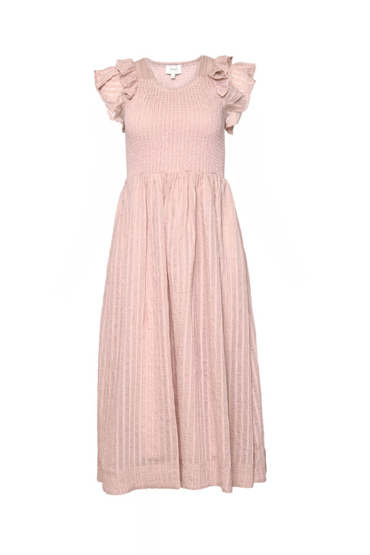 The Hattie Dress in Pink Stripes by Ivy City Co features a light pink, midi-length silhouette with subtle stripes, a textured smocked bodice, short ruffled sleeves, and a flowy pleated skirt. Its softly gathered bodice and relaxed fit create a feminine look that’s also maternity friendly, combining comfort with effortless style. The dress is displayed against a plain white background.