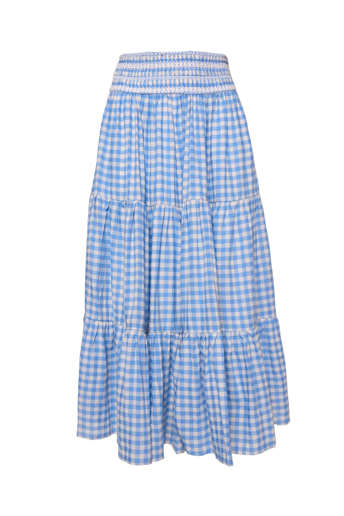 The Zoey Skirt in Blue Gingham by Ivy City Co features a smocked waistband, tiered design with gathered seams for a ruffled effect, and a flowy knee-length silhouette.