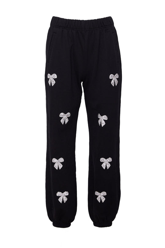Ivy City Co’s Micah Jogger Sweatpants in Black feature an elastic waistband and cuffs for a comfortable fit. These stylish black joggers are detailed with multiple white bow designs, some enhanced with sparkling rhinestone accents, printed across the front of the legs for extra flair.