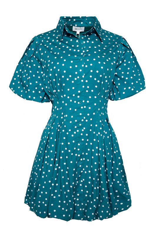 The Cody Dress in Deep Teal Polka Dot by Ivy City Co features a collared neckline, short sleeves, button front, and a white polka dot pattern. It is designed with a fitted waist and a flared skirt.