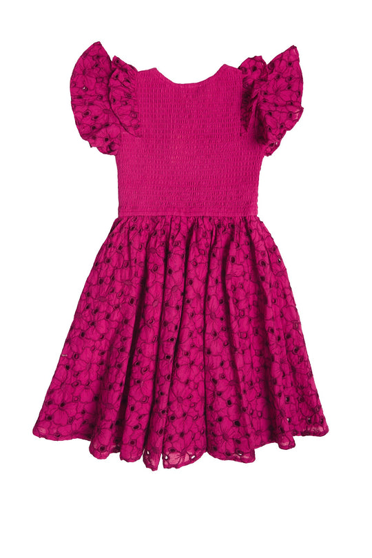 The Mini Hattie Dress in Magenta by Ivy City Co is a bright pink cotton midi dress for girls, featuring ruffled short sleeves, a smocked bodice, and a flared skirt adorned with a subtle floral pattern. Shown on a white background, this style is perfect as a Mini & Me Easter dress.
