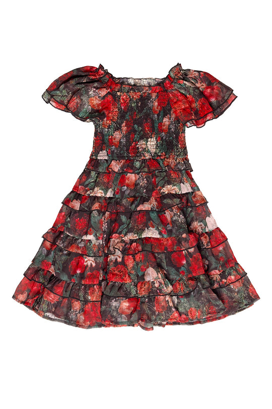 The Ivy City Co Mini Winnie Dress in Midnight Roses features short sleeves, a smocked bodice, and a layered ruffle skirt with a floral print in shades of red, black, and green—perfect for coordinating mommy-and-me looks.