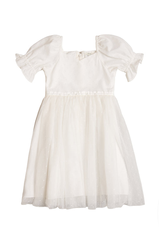 The Mini Ballerina Dress in White by Ivy City Co is a charming girls’ princess dress featuring short puffed sleeves, a fitted bodice, and a flowing tulle skirt adorned with subtle polka dot details. Finished with a sweet bow at the back, it’s perfect for any little ballerina.