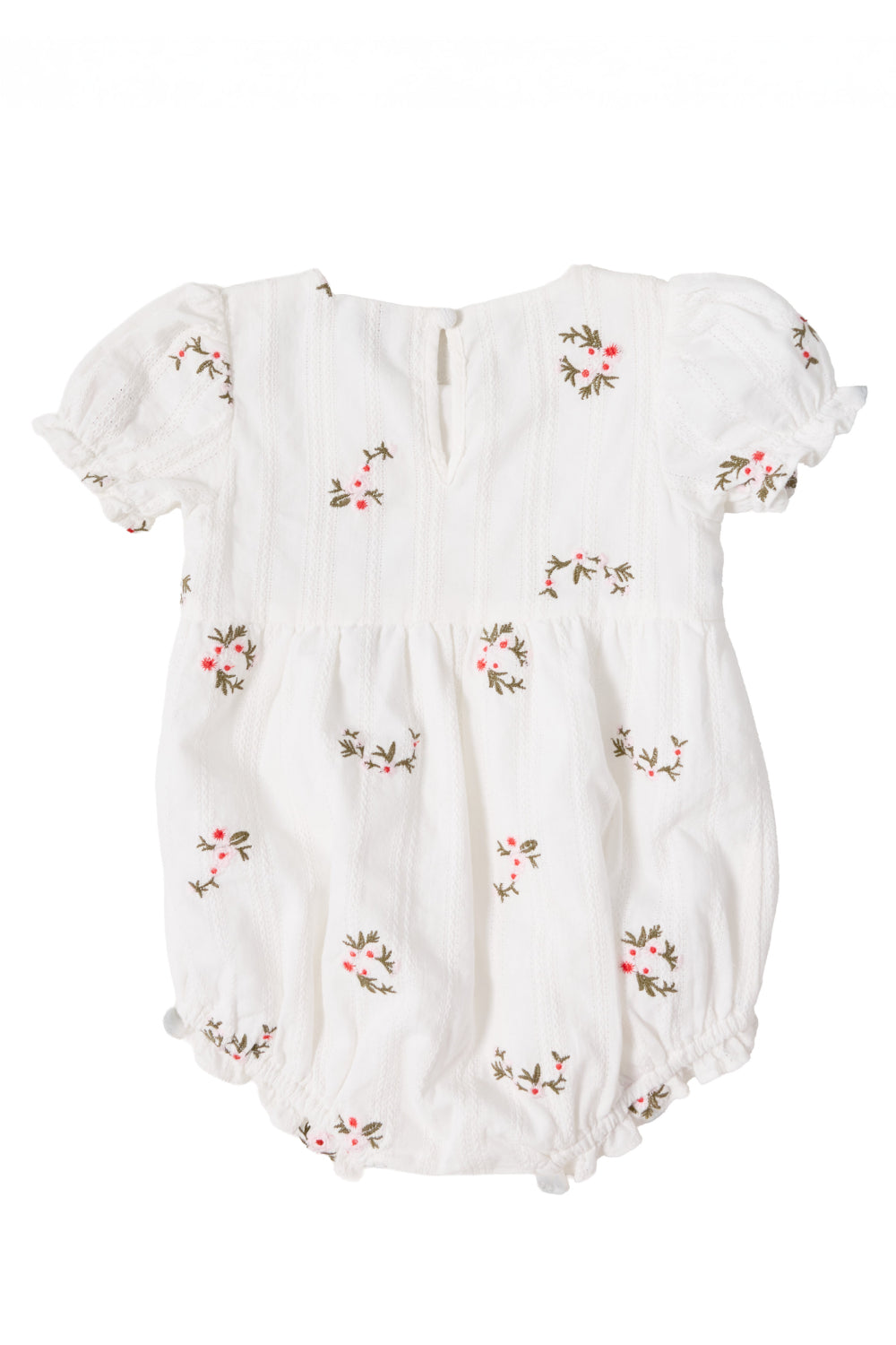 The Ivy City Co Baby Jessie Romper in Ditsy Embroidery features puffed short sleeves, a gathered waist, and delicate pink and green floral embroidery scattered throughout. Made from soft embroidered cotton, it is finished with a small buttoned keyhole opening at the back.