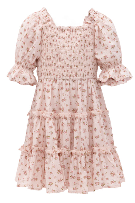 The Mini Madeline Dress in Pink by Ivy City Co features a light pink floral print, smocked bodice, short puff sleeves with ruffled cuffs, and tiered ruffles—perfect for sweet, feminine occasions.
