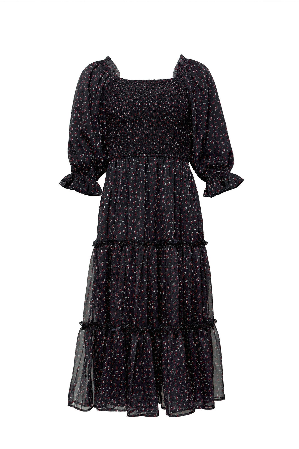 The Madeline Dress in Black Ditsy Floral by Ivy City Co is a mid-length maternity-friendly dress featuring a small ditsy floral print, puffed elbow-length sleeves with ruffled cuffs, a smocked bodice, and a tiered skirt. Designed with timeless elegance, it is finished with a classic square neckline.
