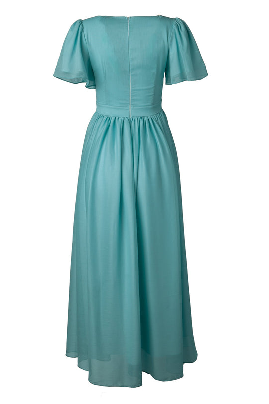 A back view of the Ivy City Co Abbie Dress in Seaglass Chiffon, featuring a light blue hue, short sleeves, an ankle-length gathered skirt, a fitted waist, and a zipper closure.