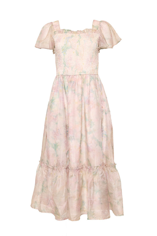 The Rhiannon Dress in Painted Bloom by Ivy City Co is an ankle-length, pastel-hued watercolor floral dress featuring short flutter sleeves, a smocked bodice, and a ruffled tier near the hem. Its soft floral watercolor pattern makes it the perfect Easter dress and maternity friendly option.