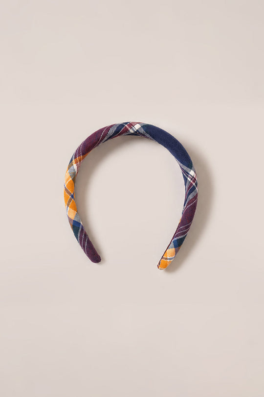 A set of hair bows in the signature Midnight Plaid pattern from Ivy City Co, featuring navy blue, burgundy, yellow, white, and green hues, displayed on a plain light beige background.