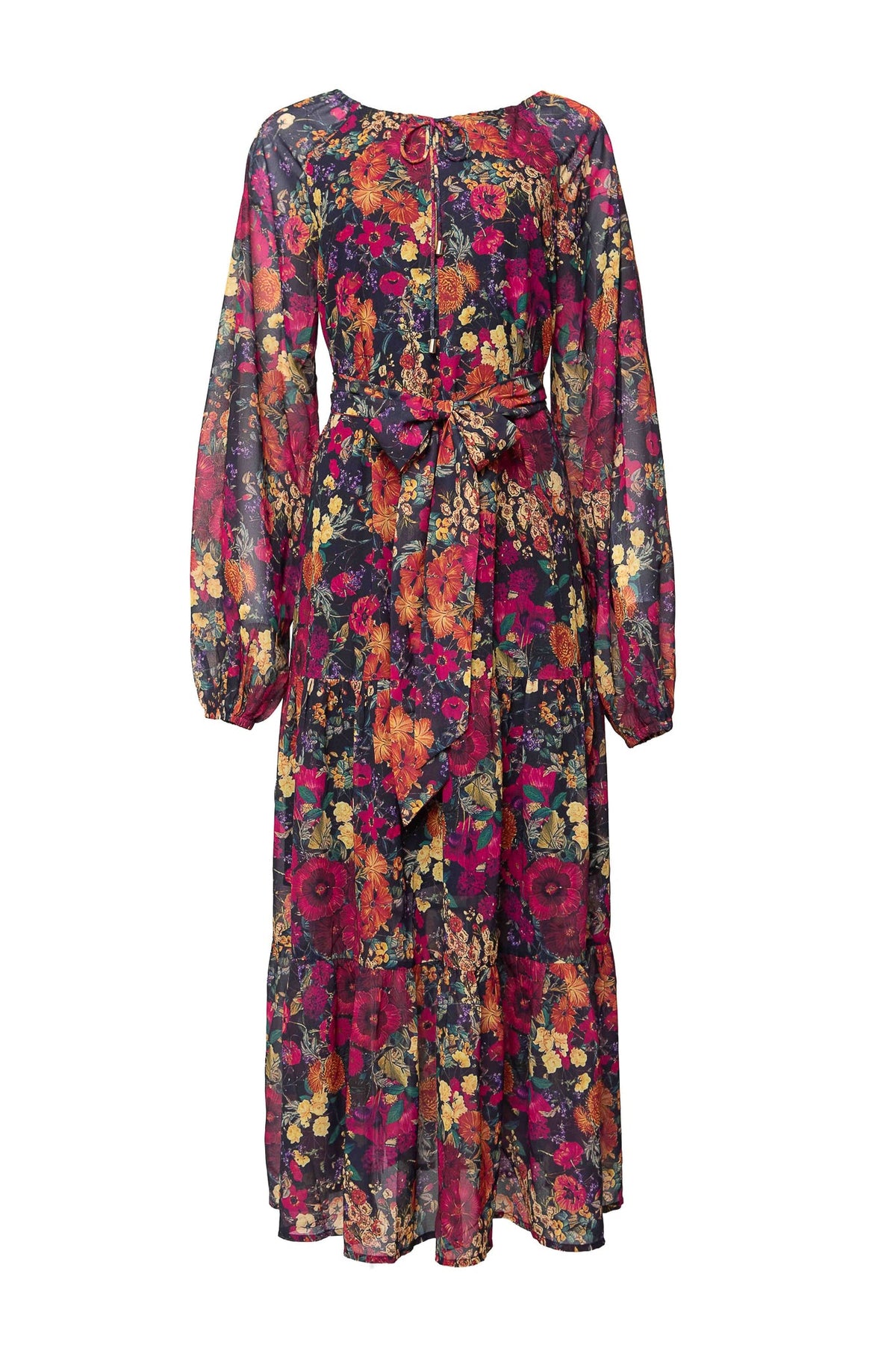 The Imogen Dress in Night Garden by Ivy City Co is a long-sleeved, sheer maxi dress with a tie waist and a vibrant floral print in red, yellow, orange, and blue hues. Featuring a flowy skirt and gathered cuffs, this fall-inspired dress is both maternity friendly and effortlessly elegant.