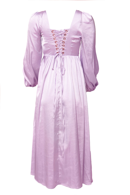 The Valentina Dress in Lavender by Ivy City Co features long sleeves, a satin finish, lace-up corset back, square neckline, and an ankle-length flowing skirt for an elegant look.