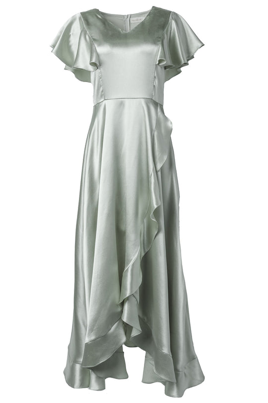 The Callie Dress in Sage Satin by Ivy City Co features light green satin fabric, short sleeves with ruffled detailing, a cascading ruffle down the front, and an asymmetrical hemline—making it the perfect choice for bridesmaids or any bridal party seeking an elegant evening gown.