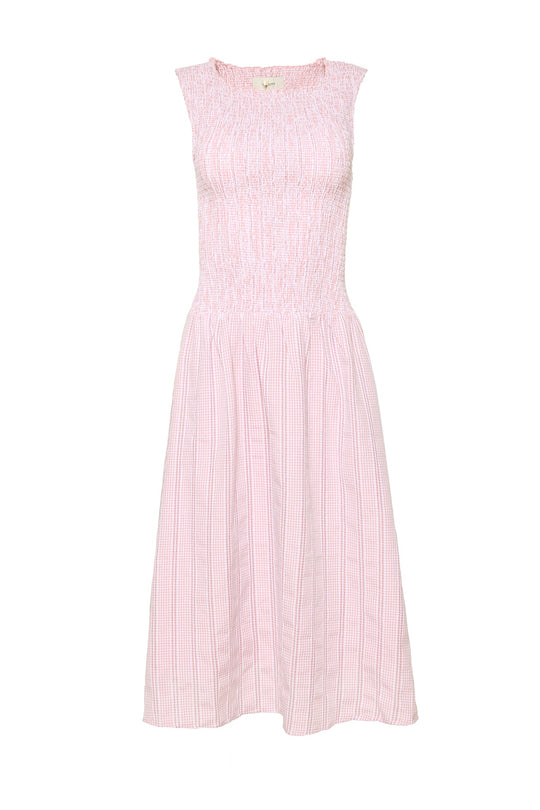 Ivy City Co’s Karla Dress in Pink Striped Gingham is a sleeveless, light pink midi dress with a smocked, fitted bodice and a gently flared skirt, featuring a subtle striped gingham pattern.